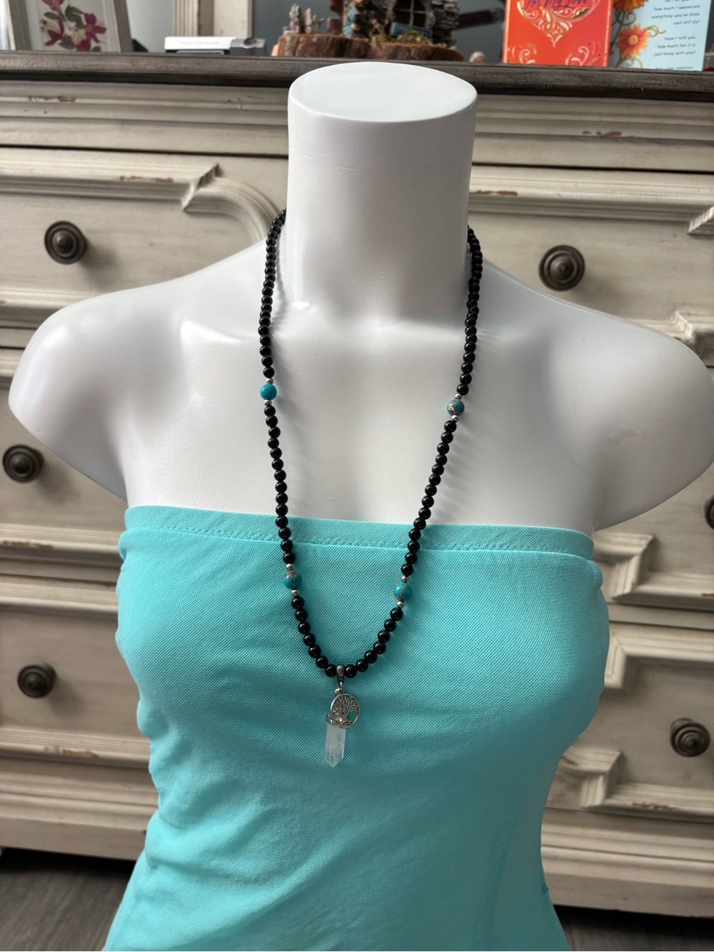 Black Beaded Necklace with Turquoise Accent Beads and Opaque Gemstone Pendant